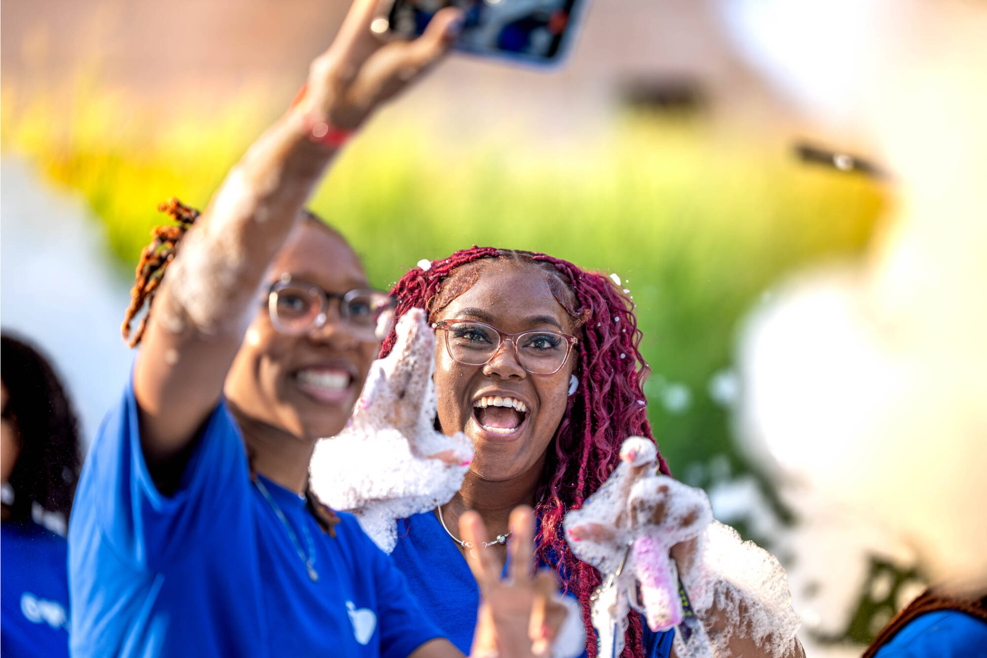 Freshmen student smiling and taking a photo in the bubble pit during Laker Kickoff on August 22nd.